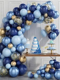 a blue and gold birthday party with balloons