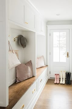 the entryway is clean and ready for someone to use it as a shoe rack