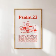 a poster hanging on the wall in a room with white walls and red lettering that reads, psalm 23