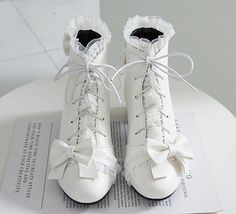 Fashion Lolita Bowtie Boots PN3713 ●Size:please see the picture. ●Heel Hight:about 3.5 cm ●Material:PU (Please allow 1-3cm differs due to manual measurement.As different computers display colors differently,the color of the actual may vary slightly from the above images.Thanks for your understanding.) ●About Shipping: We attach great importance to the orders of each customer and parcel delivery. 1.Processing time: 2-3 business days. 2.Shipping time: 10-15 business days to US, please allow 3-4 weeks shipping to other country.(Shipping times can be affected by variable customs clearance times or public holidays.) White Lace-up Boots, Cute White Closed Toe Boots, Cute White Lace-up Boots, Vintage White Boots For Spring, Fitted White Lace-up Boots, White Vintage Boots For Spring, Pink Bow Boots, White High Heel Boots With Laces, Pink Cute Shoes With Bow