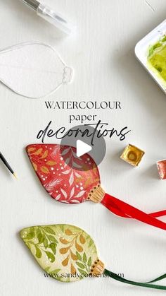 watercolour paper decorations with scissors and paint