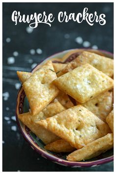 a bowl filled with crackers sitting on top of a table