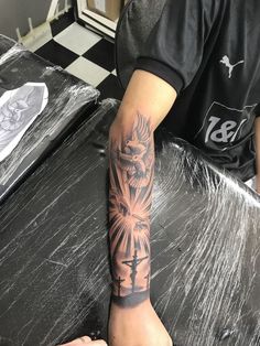 a man with a tattoo on his arm