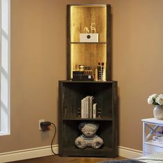 a teddy bear sitting on top of a wooden shelf next to a mirror and bookshelf