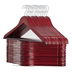 a stack of red plastic hangers on a white background with clippings for clothes