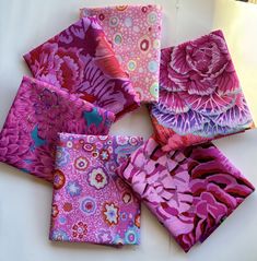 six square pieces of fabric with flowers on them