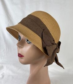 This soft Toyo Straw vintage-inspired cloche hat is lightweight and the hat will fit up to 22 5/8 inch head size which an inside sizing cord to adjust to your head size. The brim is 2 inches wide. The brim is about 4 1/2 inches tall. The bow band is made from cotton and linen blend material. NOTE: Please check the head size before purchase, I am happy to answer any questions you may have. There will be a 20% restocking fee for all returned hats. Vintage Brown Hats For Beach, Vintage Fedora One Size Fits Most, Adjustable Fedora Mini Hat For Church, Beige Cloche Hat For Church, Brown Brimmed Cloche Hat One Size, Brown Cloche Hat With Short Brim, Summer Cloche Sun Hat, One Size Fits Most, Brown Brimmed Cloche Hat, One Size Fits Most, Brown Brimmed Cloche Hat