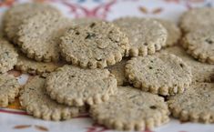 small cookies are arranged on a table cloth