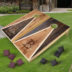 a cornhole game set up in the grass with several pieces cut out to look like it's been made from wood