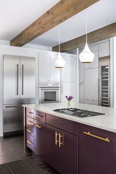 a kitchen with white counter tops and purple cabinets