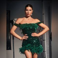 The Classic Mini Dress Features A Shoulder-Baring Silhouette With An Allover Sequin Design Featuring A Flock Of Green Feathers. Feather Mini Dress, Green Feathers, Sequin Design, Black Formal, Jumpsuits And Romper, Green Sequins, Feather Dress, Maxi Dress Green, Classic Mini