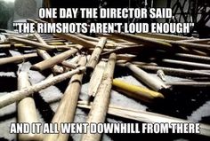 a pile of baseball bats sitting on top of a black and white blanket with the caption one day the director said,'the rinshots aren't loud enough