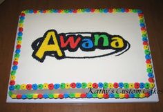 a birthday cake with the name avana on it, decorated in multicolored icing