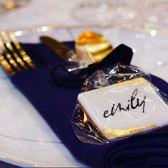 a place setting with napkins, fork and knife on the plate that says enlify