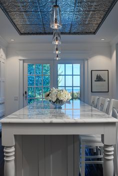 the kitchen counter is clean and ready to be used as a centerpiece for the dining room