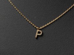 "Mini paved initial necklace makes a unique and personalized gift that sure to surprise and delight just about anyone on your list. 🤍This stylish pendant necklace features a mini monogram with bamboo textured initial is an ideal gift for moms, sisters, daughters, hostesses - and even yourself! - it's a way to reflect one's individuality with an added touch of charm.   🤍Size:  Chains- 16 \"with 2\" extension Pendant: 0.2\" height and 0.2\" wide. 🤍Our jewelry comes in gift boxes. You can add pe P Initial Necklace, P Necklace Letter, P Necklace, Elegant Gold-tone Initial Pendant Chain Necklace, 14k Gold Initial Pendant Jewelry, Gift For Her, Gold-tone Initial Pendant Jewelry With Gold Chain, Initial P, Bamboo Texture, Small Letter