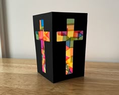 a box with a cross cut out of it