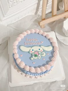 a birthday cake with an image of a bunny on it