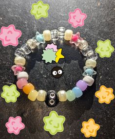 ✩ Studio Ghibli / Spirited Away inspired bracelet ✩ These cute little soot sprite bracelets change color in the sun though the power of uv sensitive beads  ✩ Kandi singles / beaded bracelets ✩ All orders come with extra goodies ^^ Colorful Handmade Rave Bracelets, Handmade Multicolor Rave Friendship Bracelets, Rainbow Beaded Bracelets For Rave Gift, Rainbow Beaded Bracelets For Gifts, Rave Style, Rainbow Colored Rave Style Beaded Bracelets For Gifts, Handmade Rave Stretch Bracelet As Gift, White Rave Bracelets Gift, Handmade Stretch Bracelet For Rave Gift, Handmade Stretch Bracelet For Gift