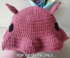 a crocheted pink hat with ears on it and the words, free pattern only