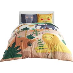 a bed with animals and plants on it