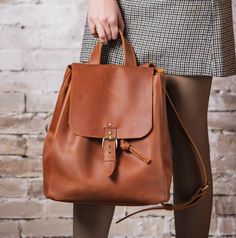 🌟- 50% Off Sale on Leather Bag for Woman🌟 Leather Women's Backpack - a perfect blend of style, functionality, and durability. Handcrafted backpack is designed to complement the modern dynamic lifestyle. The backpack features a thoughtfully organized interior, with pocket to keep your essentials in order. Whether you're heading to the office, embarking on a weekend getaway, or exploring the city, this backpack provides ample space for your belongings. The adjustable leather straps offer comfort Brown Satchel Backpack For Everyday Use, Leather Softback Backpack For Daily Use, Everyday Backpack With Leather Backing, Leather Bags With Adjustable Strap And Softback, Brown Leather Satchel Backpack, Everyday Softback Satchel, Soft Leather Backpack Shoulder Bag For Everyday, Large Capacity Daily Satchel Backpack, Everyday Large Capacity Satchel Backpack