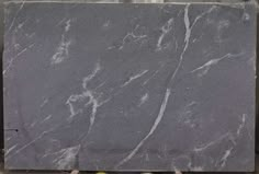 a gray marble slab with white veining