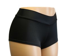 Black Matte Spandex Booty Shorts Mid Rise with a flirty cheeky back side. SIZING INFO ⭐Sizing Chart in Photos⭐ If you need help with sizing, send me a message and please include the following measurements: ✅NATURAL WAIST ✅HIPSTER WAIST ✅HIPS ✅Thigh ⭐Inquire within for Adult 6X and up. CUSTOM REQUESTS 👉Need the waist higher/lower? 👉Inseam longer/shorter? 👉Love this style but not the fabric or color? 👉Love this fabric and color but not this style? 👉Looking for something different I don't have Spandex, Rave Bottoms, Dance Pole, Panty Liner, Cheer Dance, Black Matte, Burning Man, Dancer, Mid Rise