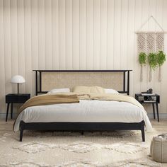 a bedroom with a bed, nightstands and plants on the wall behind it in shades of beige