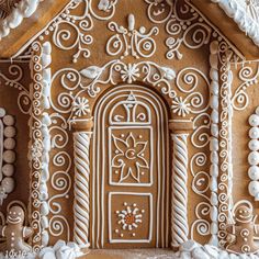 an elaborate gingerbread house decorated with icing