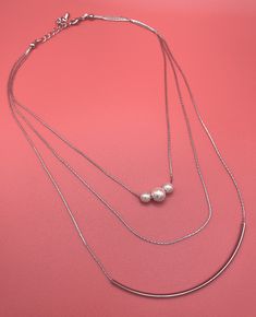 🌿 Materials: Faux Pearls Silver-Plated Chain (Non-Tarnish) 1st layer 14.5" + 2" extension chain holds the 3 pearl beads 2nd Layer is 16"  + 2" extension chain  3rd Layer is 17.5"  + 2" extension chain, adorned with a sparkling tube accent. Lobster Clasp Closure Meticulously crafted, this necklace showcases a brilliant arrangement of faux pearls suspended from a silver-plated, non-tarnish chain. The intricate design reflects artisanal excellence, making it the perfect accessory for any occasion. Tarnished Silver, Wedding Jewellery Necklace, Silver Accents, Intricate Design, Silver Pearls, Engagement Wedding, Wedding Necklace, Pearl Beads, Formal Wear