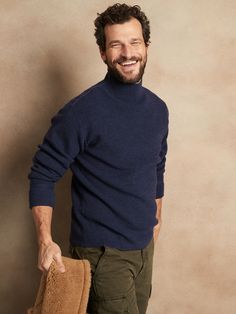 Inspired by sweaters worn by members of the Navy through the 1940s and 1950s, this classic turtleneck has a chunky ribbed knit stitch for extra warmth and comfort.  3-SEASON WARMTH: Soft and cozy, our designers chose this 12-gauge Merino wool yarn for it's midweight warmth so you can layer it through the seasons.  RELAXED FIT: Almost oversized.  Dropped shoulder.  Turtleneck.  Allover ribbed knit stitch.  Straight hem.  Relaxed fit.  Long sleeves.  Hip length.  Body length (size M): Regular 27", Apres Ski Men, Turtleneck Outfit Men, Blue Outfit Men, Navy Blue Outfit, Sweater Outfits Men, Deep Winter Colors, Knit Sweater Outfit, Turtle Neck Men, Classic Turtleneck