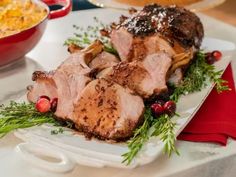 some meat is sitting on a white plate