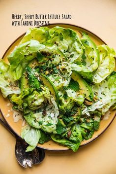 a plate filled with lettuce and other vegetables