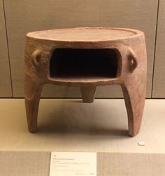 an old stone oven sitting on top of a table