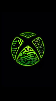 the xbox logo is lit up in green on a black background with an abstract pattern