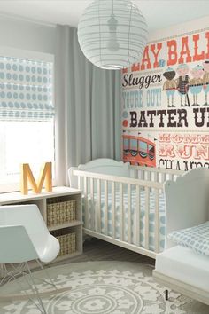 a baby's room with blue and white decor