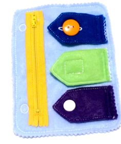 an assortment of colorful felt items in a zippered pouch on a white background,