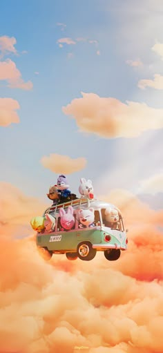 an old vw bus is flying in the sky with some stuffed animals on top