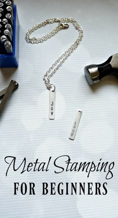 metal stamping for beginners on a sheet of paper next to a pair of scissors