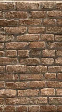 a brown brick wall with no mortar