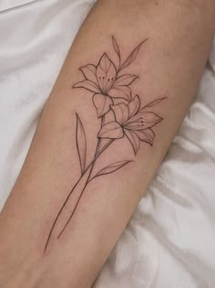 a black and white photo of a flower on the left arm, with lines drawn across it