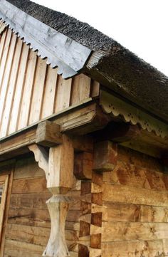 a close up of a wooden structure on the side of a building