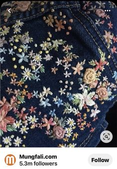 the back of a woman's jeans with flowers on it, and an instagram button