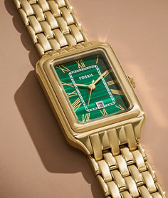 The rectangular Raquel watch is a new classic, updated for the current moment. Slim and versatile, this one-of-a-kind timepiece features a genuine malachite stone dial, three-hand date movement and a brushed and polished gold-tone 7-link bracelet.

Engravable watches. Embossable leather goods. Handpicked jewelry. It’s your destination for those “more than just a gift” gifts—just in time for Mother’s Day. Timeless Rectangular Watch With Polished Finish, Timeless Green Watch Accessories With Metal Dial, Timeless Green Watch With Date Display, Timeless Green Watch Accessories With Date Display, Green Timeless Watch Accessories With Date Display, Luxury Green Watch With Rectangular Dial, Green Formal Watch With Date Display, Formal Green Watch With Date Display, Timeless Watch Accessories With Rectangular Dial And Date Display