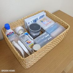 a wicker basket filled with items on top of a wooden table