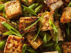 tofu, green beans and asparagus stir fry in a pan