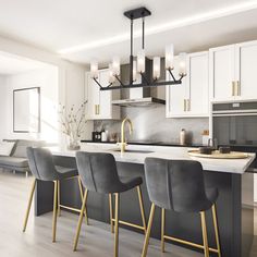 a kitchen with white cabinets and black counter tops next to a dining room table filled with gray chairs