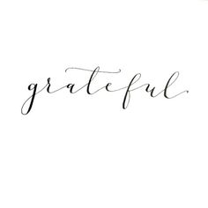 the word grateful written in cursive ink