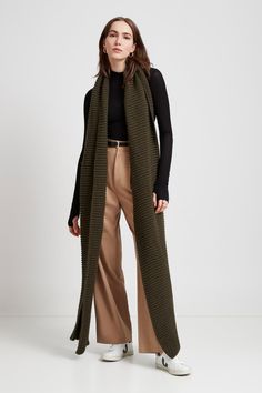 Make your style A LOT cozier with our extra-long Bronx Scarf. Bronx is both knit from ultra-soft French Merino Wool mix to warm your soul and fashioned extra long to make a statement. Wrap this Merino wool scarf around and around for volume, or wear her draped over your shoulders to lend your look texture and drama. This soft wool scarf also doubles perfectly as an airplane blanket.[SPLIT] Steph, in olive, is 5'11" (180 cm) tall. Maritza, in black, is 5'9.5" (177 cm) tall. Julia, in light beige, Burnt Yellow, Airplane Blanket, Merino Wool Scarf, Cozy Accessories, Crochet Clothing, Oversized Scarf, The A Team, Long Scarf, Grey Women